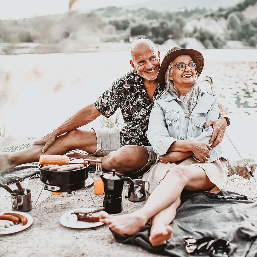 Grandparents with family at a picnic